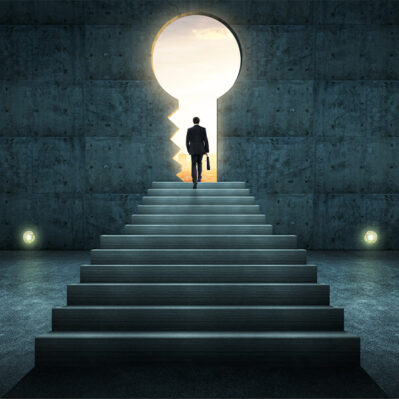 person walking through key shaped doorway