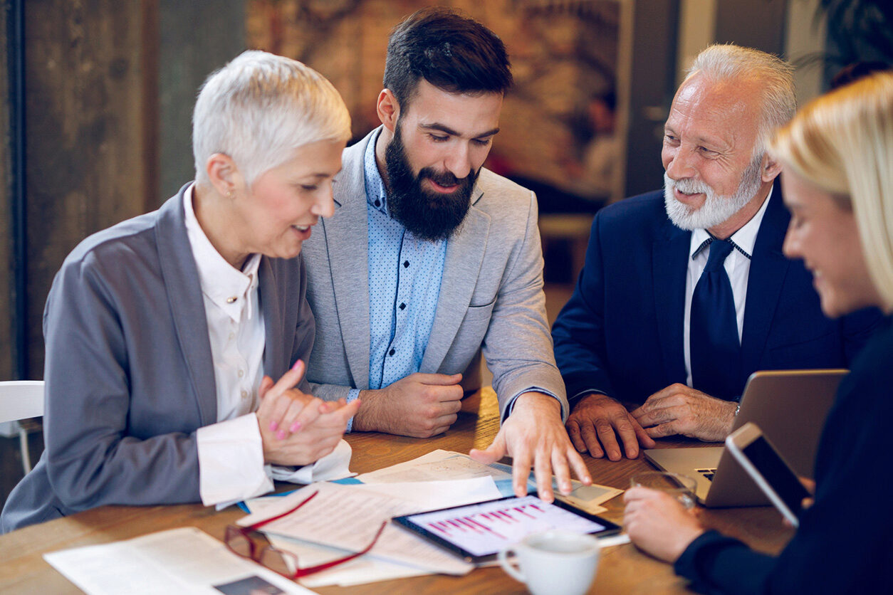 small group of execs in a meeting