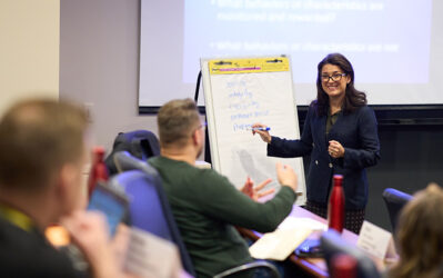 faculty and participant interacting