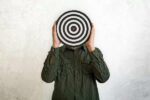 man holding a bullseye