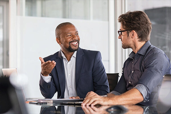 executives talking and smiling